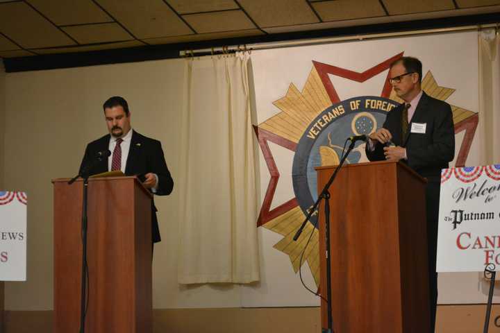 Michael Bartolotti, left and Lithgow Osborne met in debate on Wednesday.