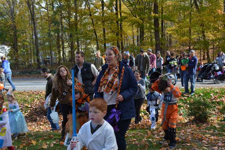 Halloween parade marchers in Somers proceed from Route 100 to Bailey Park