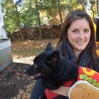 <p>Somers resident Michelle Chiappa with her dog Frank, who is dressed as a hotdog. Frank, who is a rescue dog, won Coolest Canine Costume in a contest.</p>