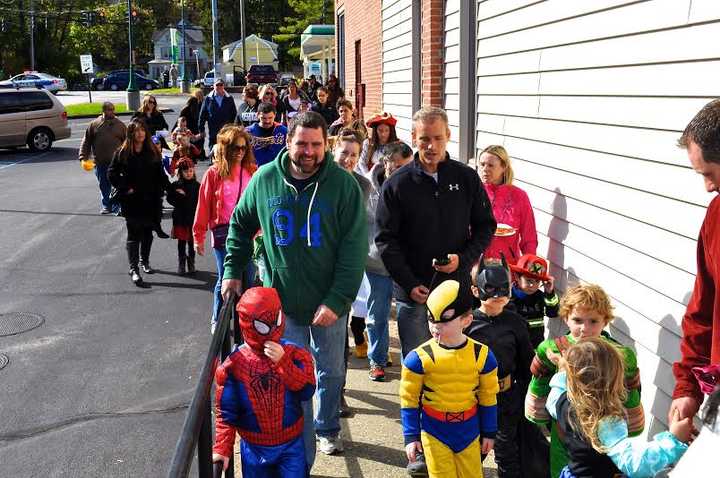 Children and parents line up to march in the Raggamuffin parade. 