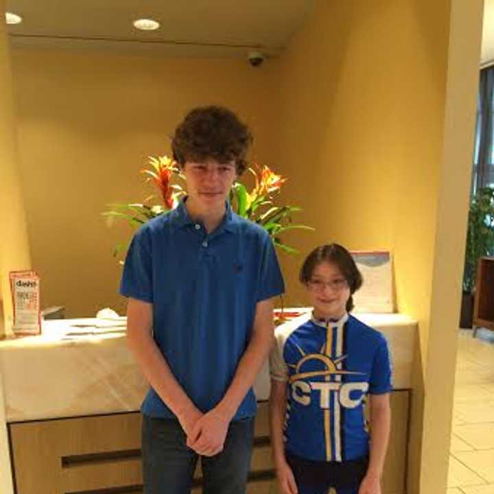 Andrew Day, left, a high school senior, will run the New York City Marathon for the Southport-based Connecticut Challenge. He is shown with Maya Oberstein, who was the co-chair of the Challenge&#x27;s annual summer bike ride.