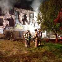 <p>Firefighters battle a fire in Buchanan. </p>