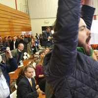 <p>A protester holds up a sign and interrupts the speech by President Barack Obama. </p>