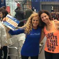 <p>Lauren Field and Beth Segaloff of Fairfield show off their numbers prior to the TCS New York City Marathon.</p>