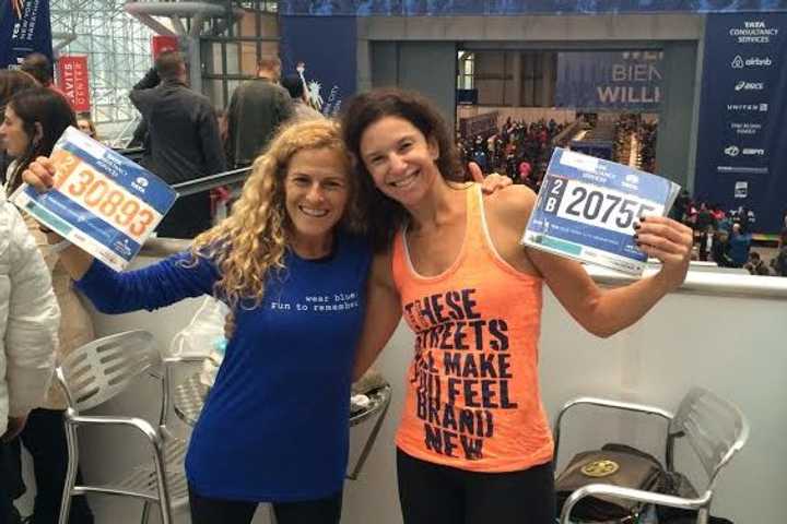 Lauren Field and Beth Segaloff of Fairfield show off their numbers prior to the TCS New York City Marathon.