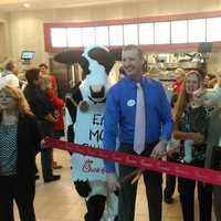 <p>Rich Beattie, owner/operator of the new Chick-fil-A at the Danbury Fair Mall, holds a ribbon-cutting ceremony flanked by Mayor Mark Boughton and the fast-food restaurant&#x27;s mascot cow. </p>