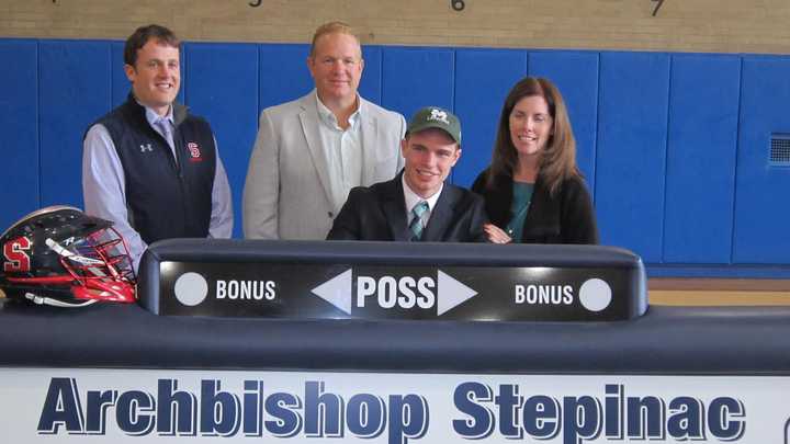 From left: Lacrosse head Coach James Goldmann, Mr and Mrs Frank DeMuro and Dylan DeMuro. 