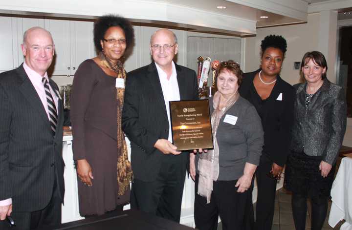 Peter Nucci, Jr., president and CEO of The Connection (third from left) accepts the FCA Family Strengthening Award with The Connection staff and FCA President and CEO Robert F. Cashel (far left).