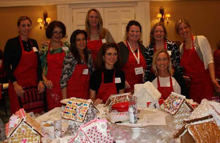 Women display gingerbread houses from last year&#x27;s fundraising event for Stamford&#x27;s The Center for Sexual Assault Crisis Counseling and Education.