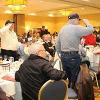 <p>Veterans stand and salute while their branchs fight song is sung to the crowd.
 </p>