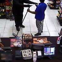 <p>The second suspect, seen with a gun.</p>