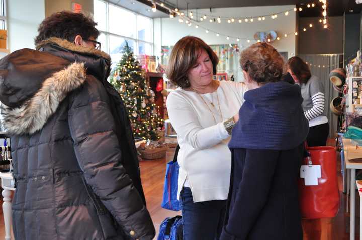 A Fairfield shopkeeper helps a customer at a past Small Business Saturday.