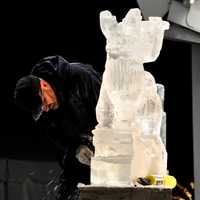 <p>Watching an ice sculpture being created at the Winter Wonderland festivities.</p>