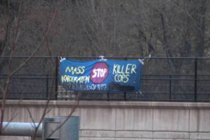 Banner On I-287 Makes Reference To Killing By Police