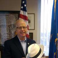 <p>Danbury Mark Boughton participates in the annual Hat City Day celebration.</p>