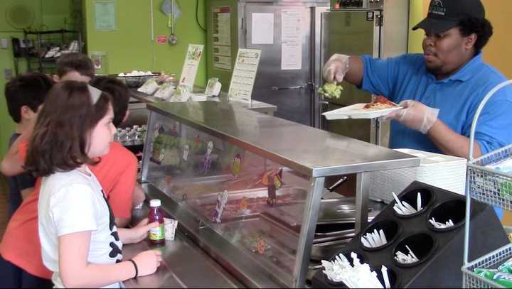 Todd Elementary School fifth-grader Luella waits for her spaghetti with meatballs and broccoli to be served.