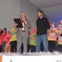 <p>Mayor Harry Rilling declares December 2nd as STAR, Inc., Lighting the Way Day. Mark Minnock of Theater of STARs looks on. Cast stands in background.</p>