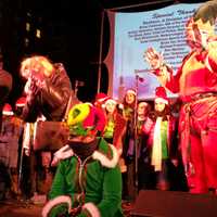 <p>New York Yankees General Manager Brian Cashman (center, green) and Former New York Mets Manager Bobby Valentine (right, red) stand on stage as guest stars to Stamford&#x27;s Holiday Tree lighting finale.</p>