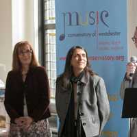<p>Music Conservatory of Westchester Executive Director Jean Newton of Edgemont and Ossinings Lisa Sandagata, Music Therapy Institute co-director watch on as longtime piano student Drew Somerville of Rye explains the importance of scholarship programs.</p>