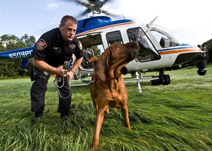 Officer Matthew Notaro with his K-9 partner, Seneca, who died last week.