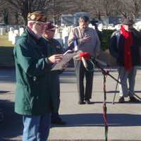 <p>Phil Kraft leads the ceremony at Spring Grove Cemetery.</p>