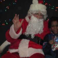 <p>Santa Claus and a young boy at the Ossining Community Center.</p>