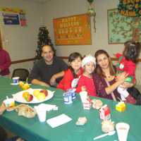 <p>The Deagustins enjoying breakfast after meeting Santa. </p>