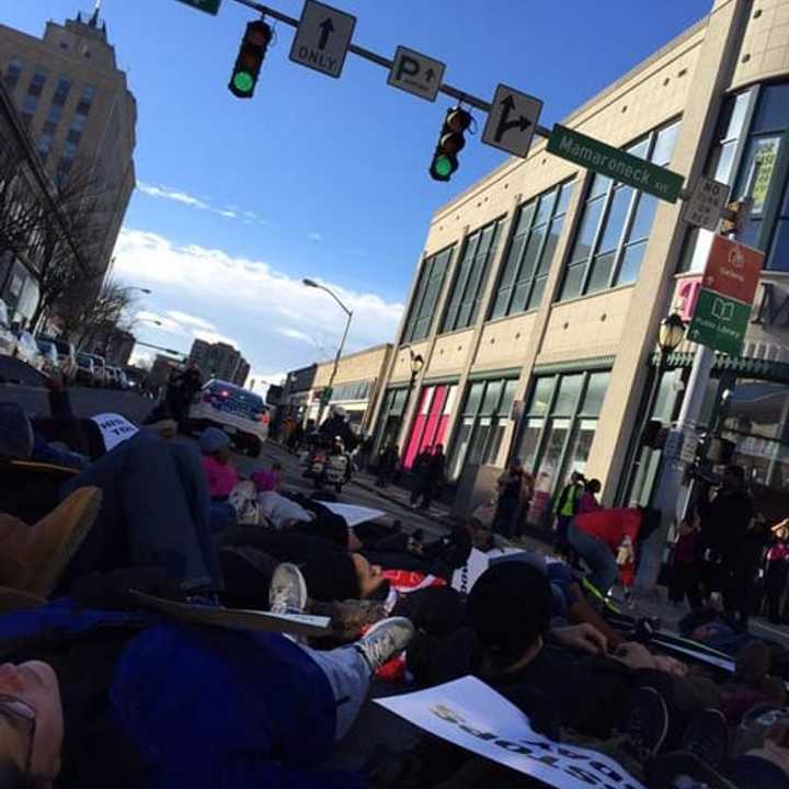 Protestors gather in White Plains on Saturday to show their displeasure with grand jury decisions in which white police officers were not indicted in incidents with African-Americans.