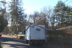 Truck Snaps Utility Pole In Westport