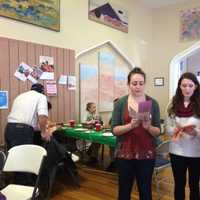 <p>Volunteer Emily Code and others singing songs at the Christmas dinner last year.</p>