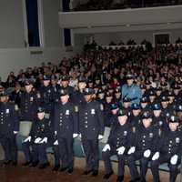 <p>The 138th basic police recruit class at Friday&#x27;s graduation. The officers standing were recognized for prior military service.</p>