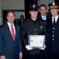 <p>Briarcliff Police Chief Norman Campion with his son, Michael, a new Mount Vernon police officer.
 
Commissioner Frank Resigno of Elmsford with son Paul
 
Photo of County Exec Astorino addressing the grads
 
T</p>