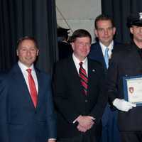 <p>Elmsford Police Commissioner Frank Rescigno, far right, with new son, Paul.</p>