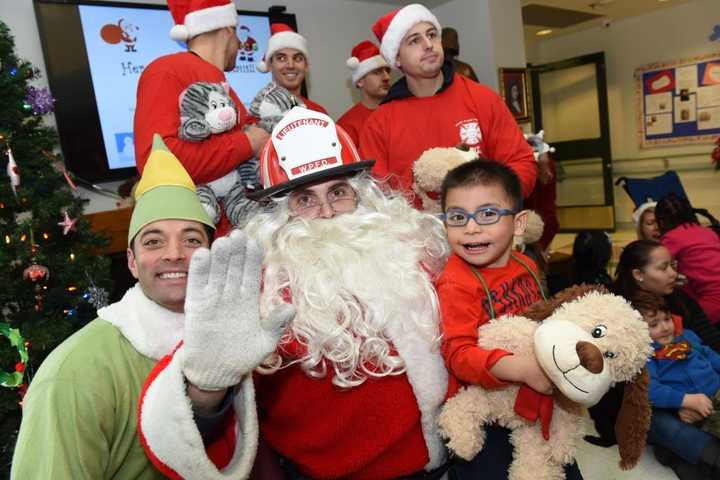 Buddy the Elf, left, with Santa Claus at John A. Coleman School.