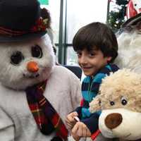 <p>Each child at John A. Coleman school received a stuffed animal from Frosty and Santa.</p>