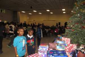 Santa Brings Gifts To White Plains Kids On Christmas Eve