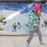 <p>Lily Schlafman, 2, of New Canaan, checks out the sock skating rink at Stepping Stones Museum.</p>