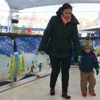 <p>Colin Suh, 2, and mom Mariela, of Stamford, explore the sock skating rink at Stepping Stones.</p>