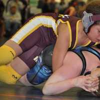 <p>Koy Price of the Norwalk Mad Bulls youth wrestling team holds the upper hand against an opponent.</p>