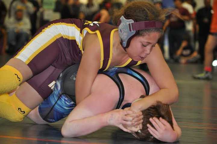 Koy Price of the Norwalk Mad Bulls youth wrestling team holds the upper hand against an opponent.