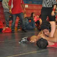 <p>Norwalk Mad Bulls wrestler Nemo Harris tries to put the finishing touches on an opponent.</p>