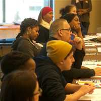 <p>Attendees discuss training adults on how to interact with kids, and dealing with racism.</p>