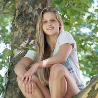 <p>Westport&#x27;s Julia Marino, a snowboarder on the U.S. national team, relaxes in a tree last summer.</p>