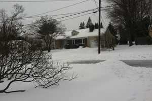 Snow Still Falling Across Stamford; Streets Remain Slick 