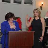 <p>HGAR Member Roberta Bangs installs Leah Caro as HGMLS President and Drew Kessler as HGAR President for 2015.</p>