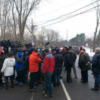 <p>Reporters and photographers converge on an interview. </p>