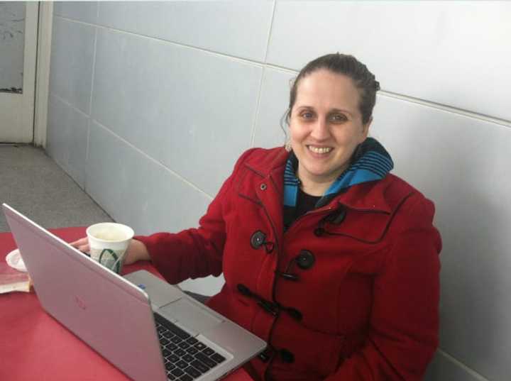 Rachel Teagle waits for her train to Washington, D.C., at the Stamford Train Station. She said safety and reliability of the rail system has to be improved for the state&#x27;s many transit commuters. 