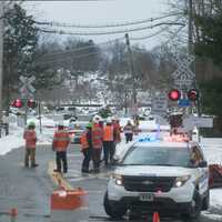 <p>Workers checked the signals at the intersection where the fatal crash took place.</p>