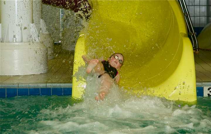 A youngster makes a quick trip down a slide at the Splash Zone at Chelsea Piers Connecticut in Stamford. 