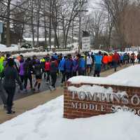 <p>Racers walk to the starting line at Tomlinson Middle School on Sunday, Feb. 8, for the Fairfield&#x27;s 20K Boston Buildup Race.</p>